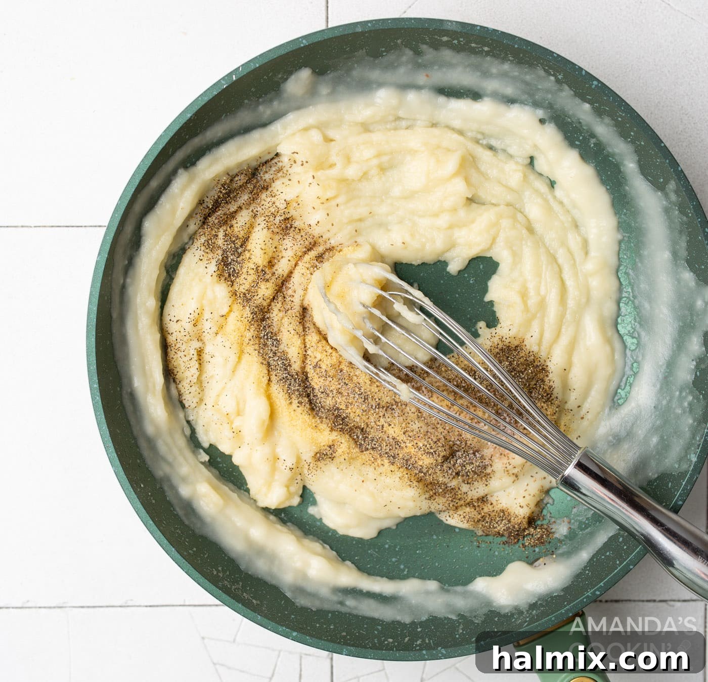 Velvety Creamy Chicken Soup 6 Adding spices and whisking them into the cream of chicken soup mixture in a skillet.