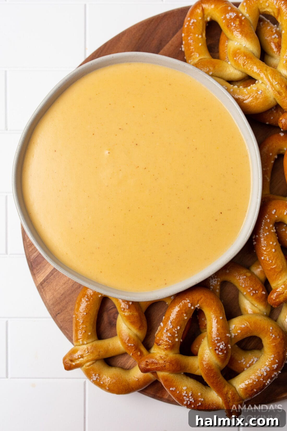 bowl of Beer Cheese Dip surrounded by pretzels