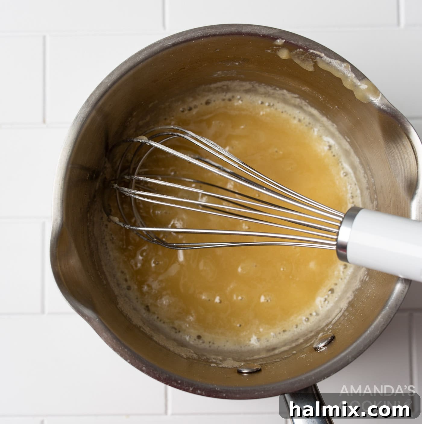 whisking butter and flour in a saucepan