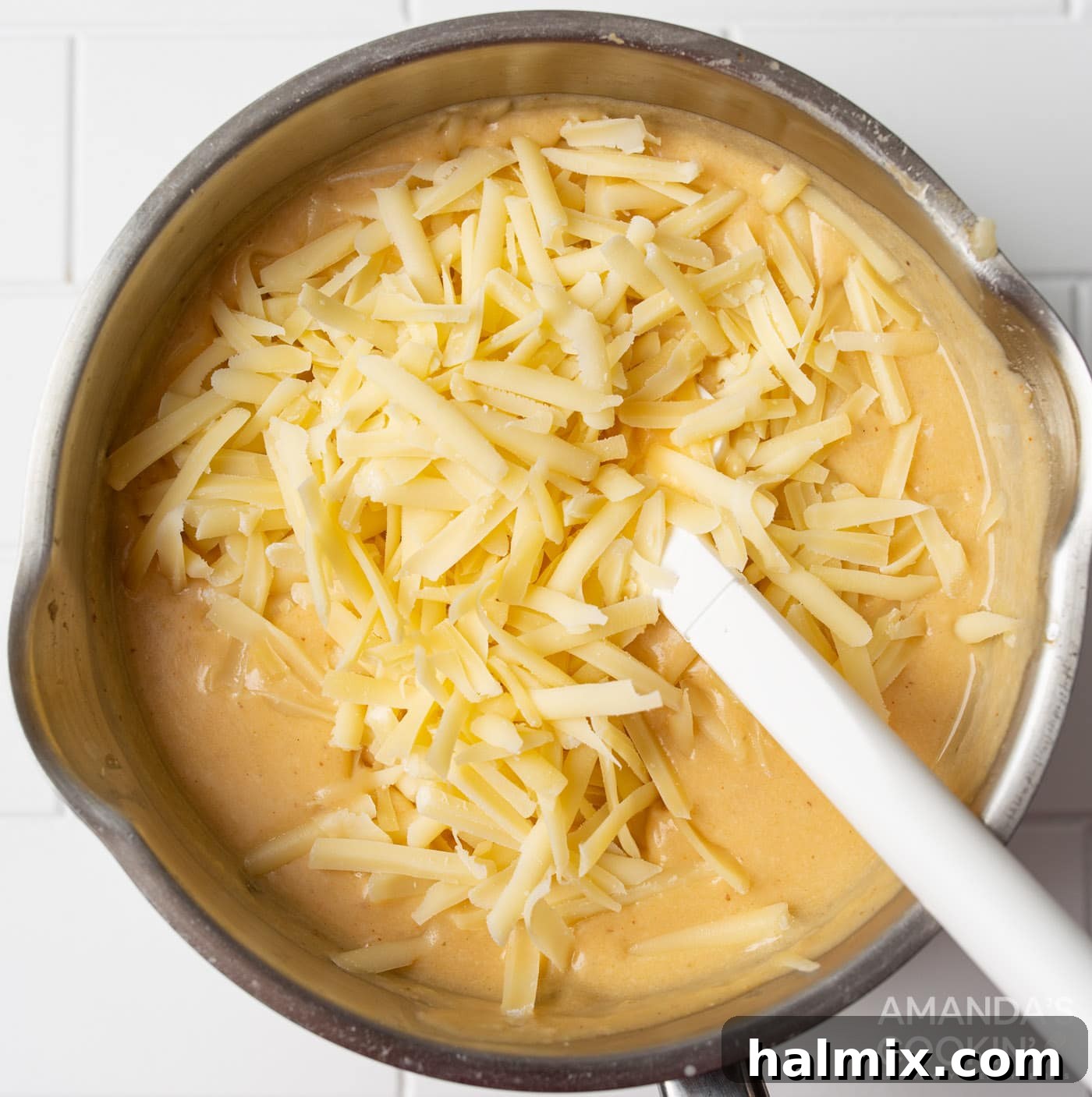 shredded cheese in beer cheese dip