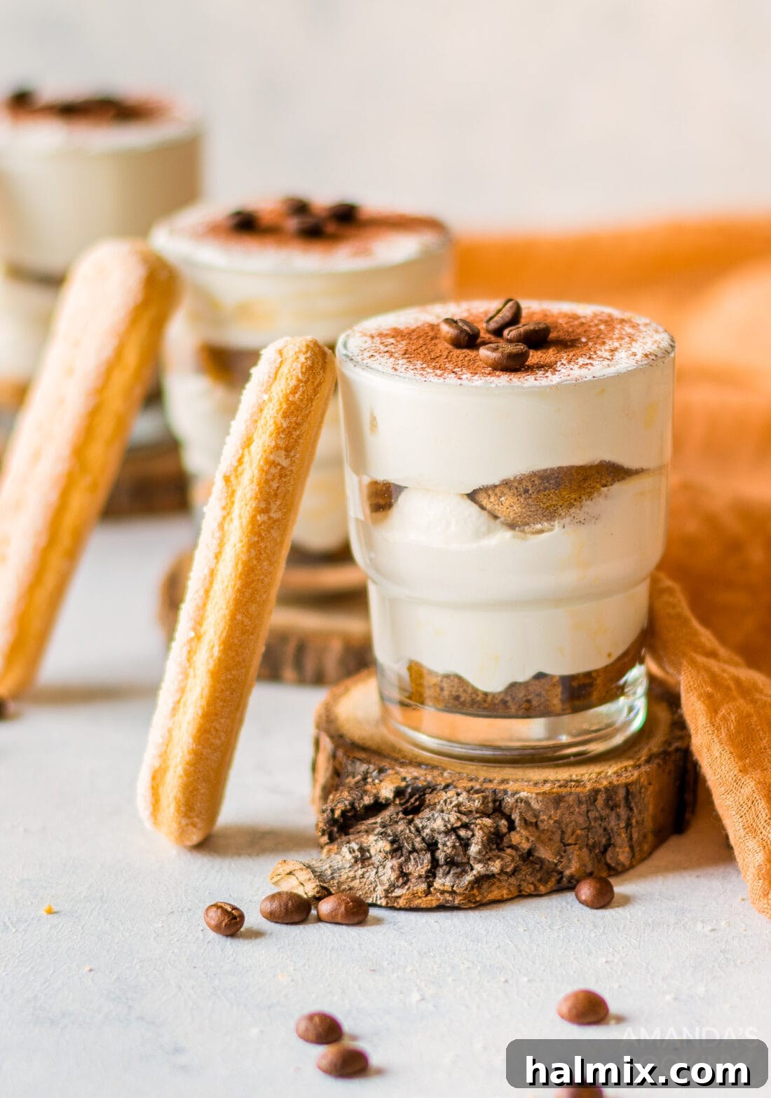 Personal Tiramisu Indulgence 2 Individual Tiramisu in little jars, showcasing rich layers of cream and coffee-soaked ladyfingers.