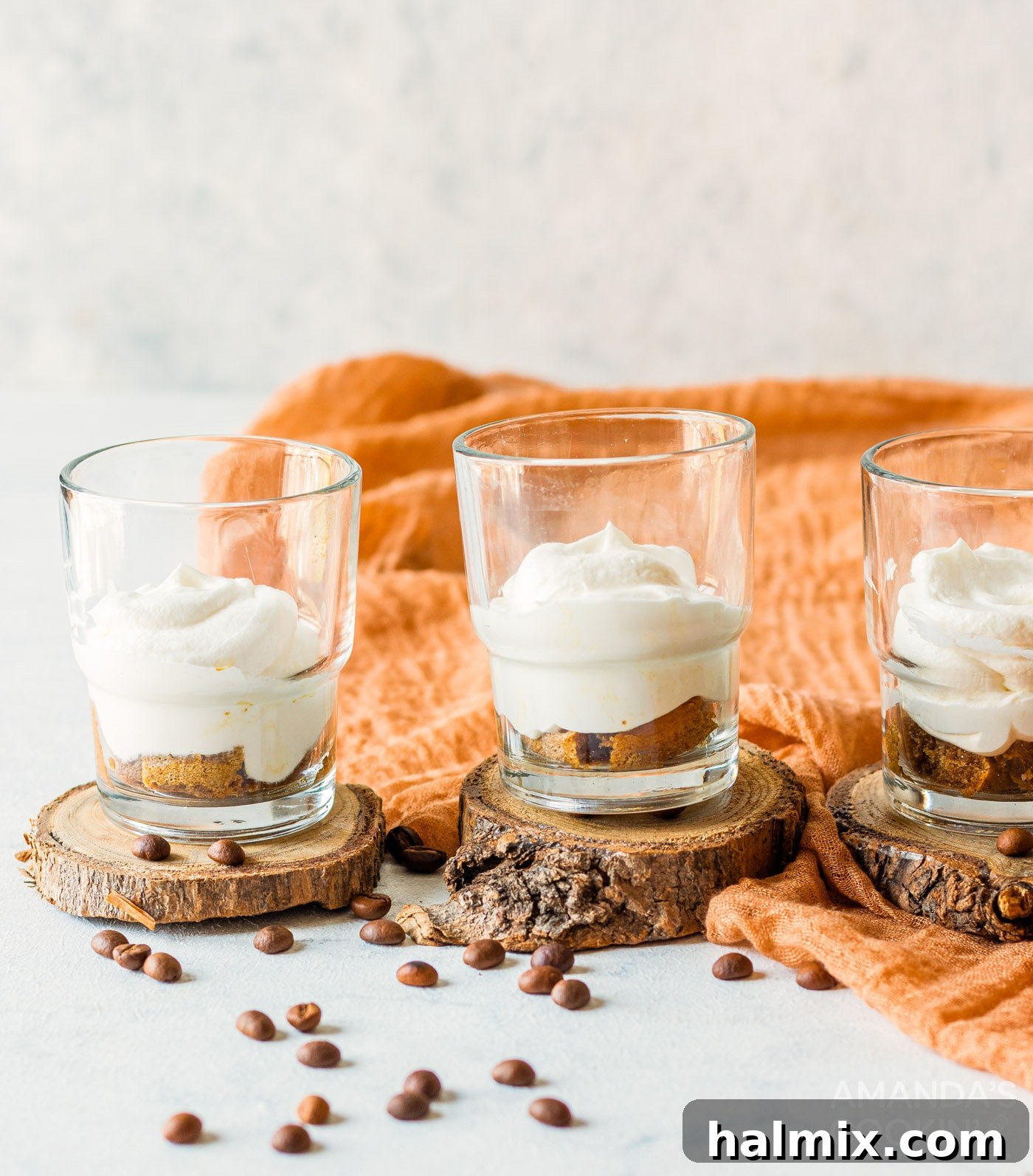 Personal Tiramisu Indulgence 7 Individual tiramisu trifles showing layers of cream and ladyfingers.