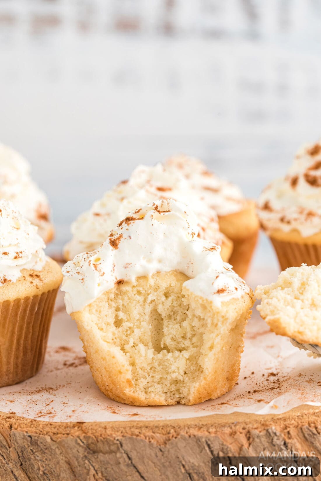 3-Ingredient Apple Pie Bites 2 Delightful apple pie cupcake with a bite taken out, showcasing its moist interior