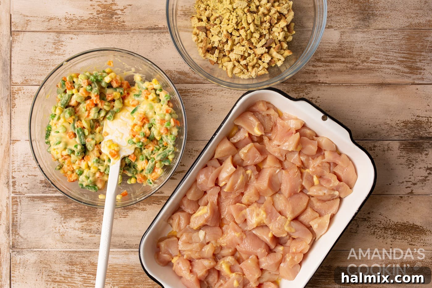 Comforting Chicken Stuffing Bake 5 diced chicken in a casserole dish with veggies and stuffing