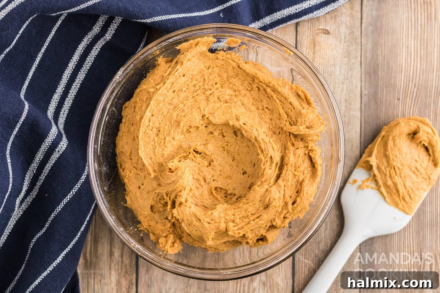 Delicious Pumpkin Cake Mix Treats 6 Pumpkin puree mixed with cake mix in a bowl, forming a moist dough