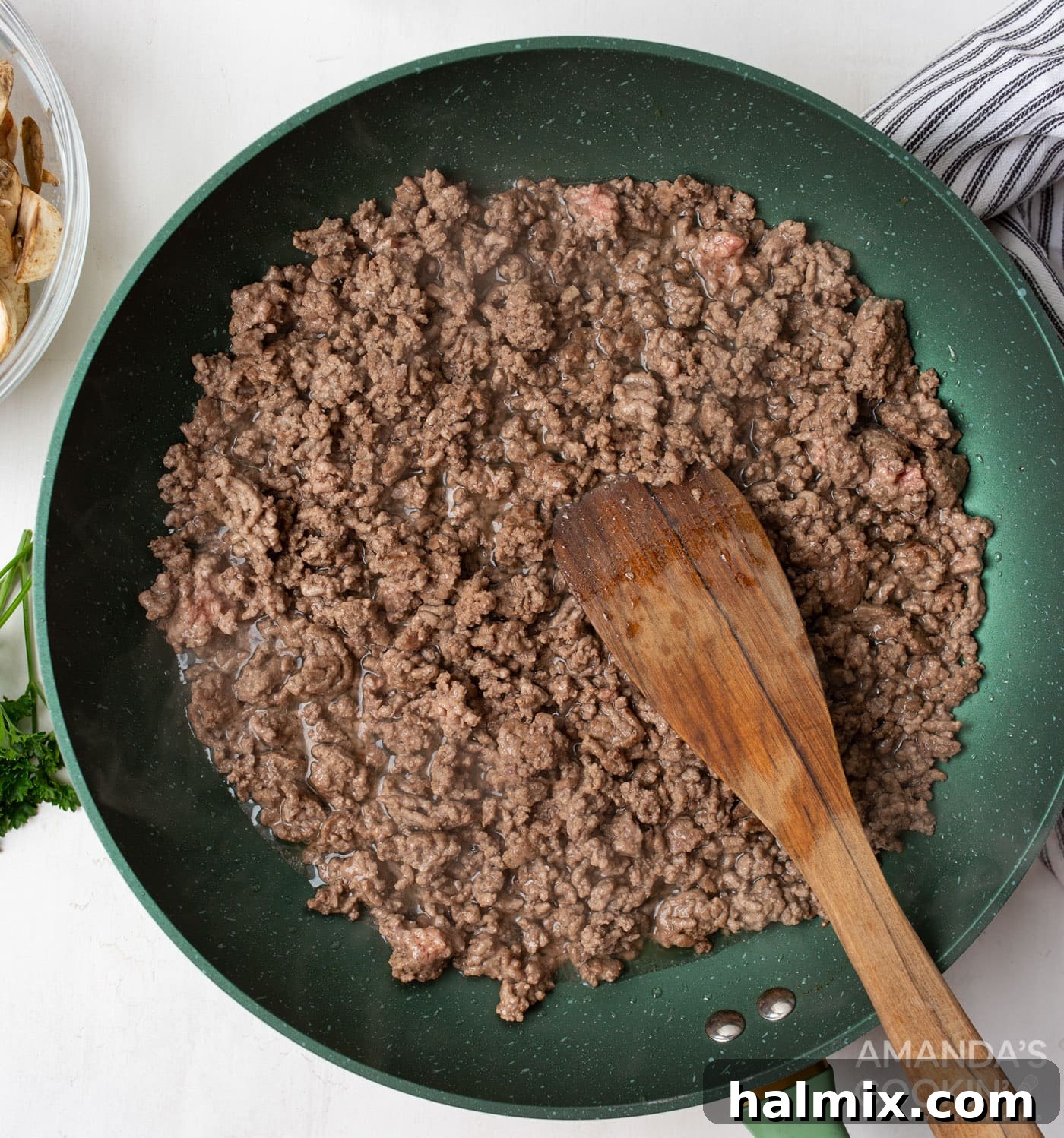 Creamy Beef Noodle Bake 5 Ground beef cooking in a large skillet, breaking apart into crumbles as it browns.