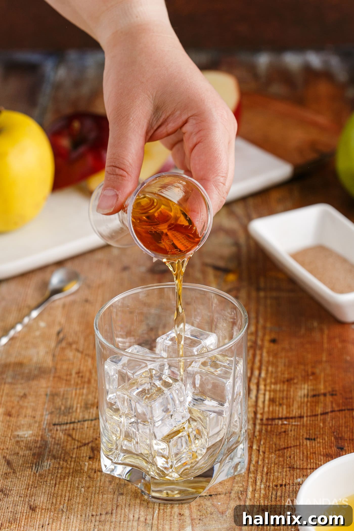 pouring fireball whiskey into a shot glass