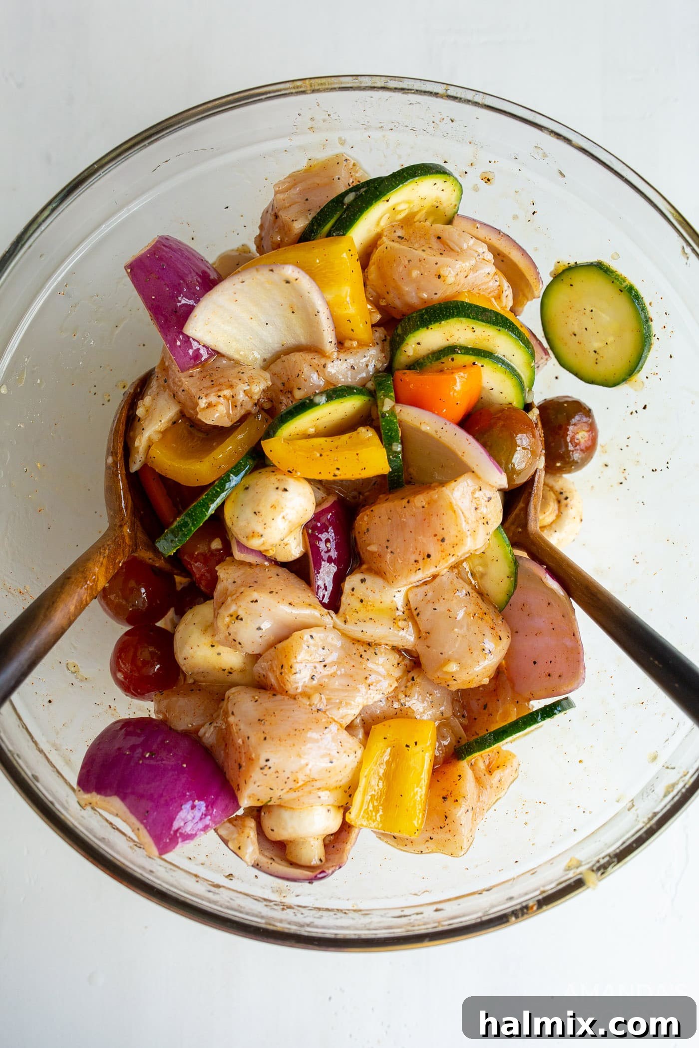 chicken and veggies in a bowl with marinade