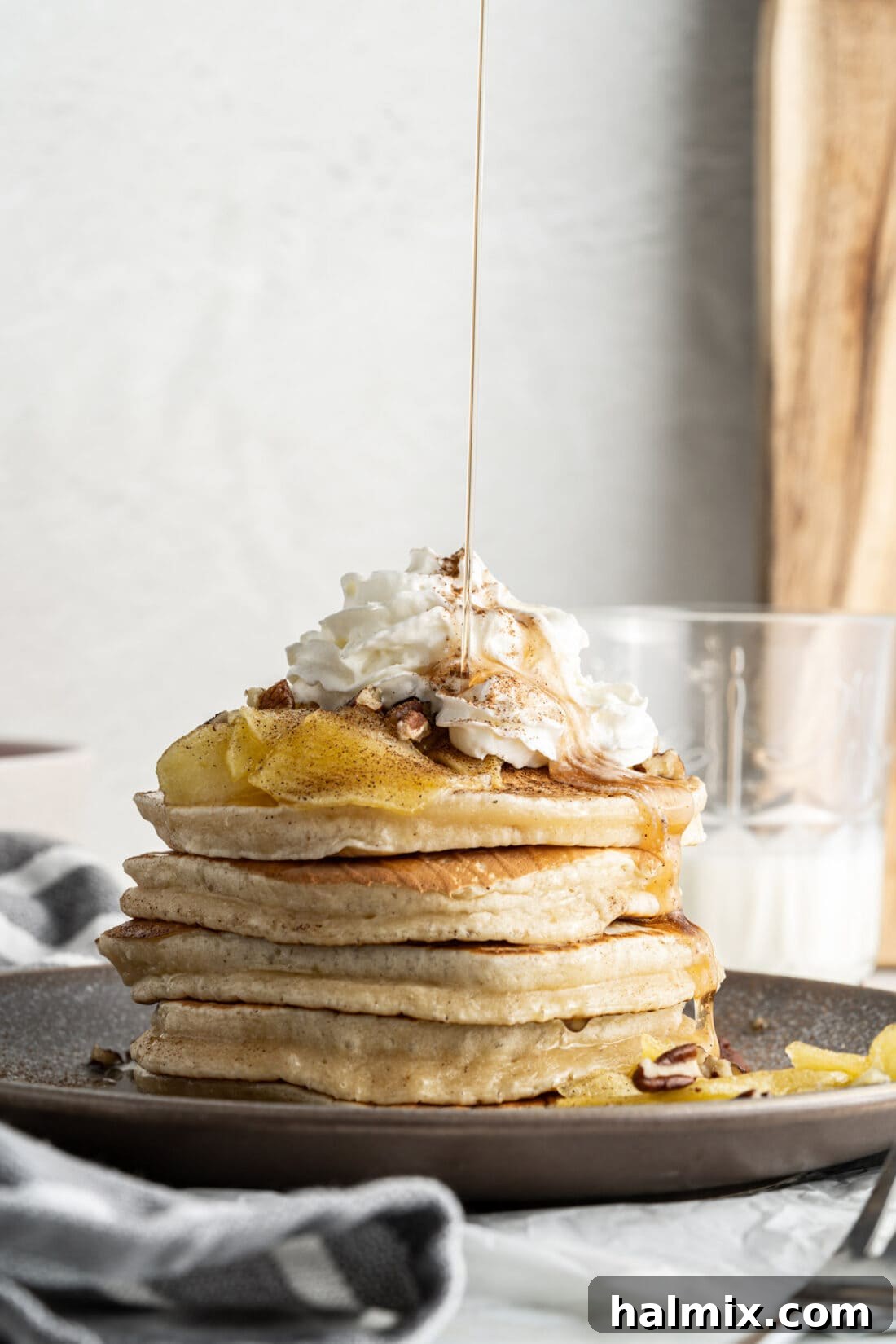 Apple Pie Pancakes 2 drizzling syrup onto apple pancakes