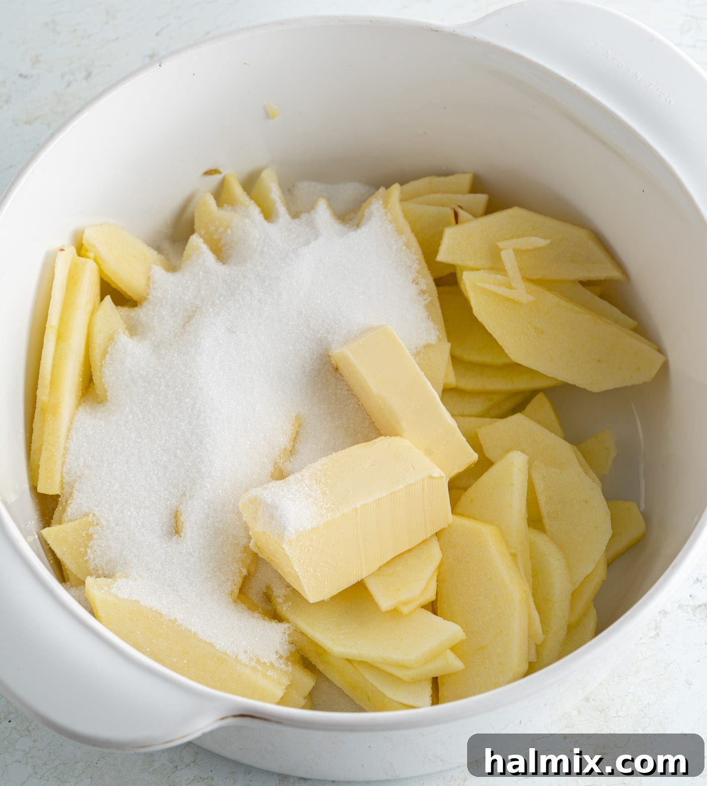 Apple Pie Pancakes 5 sugar and butter in a bowl with sliced apples
