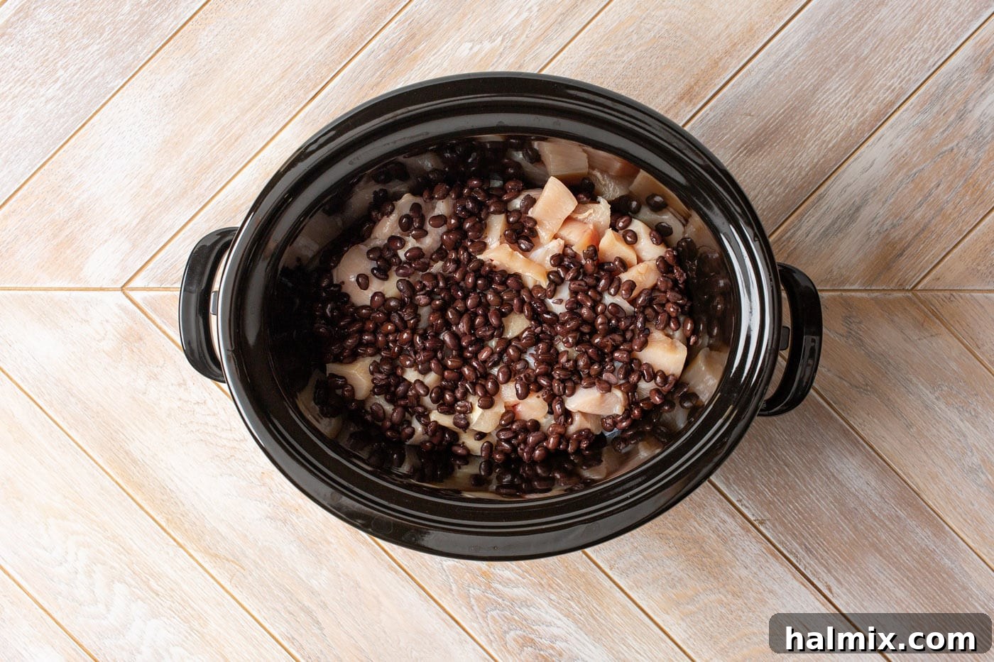 Slow Cooker Fiesta Chicken 5 chicken and black beans in a slow cooker
