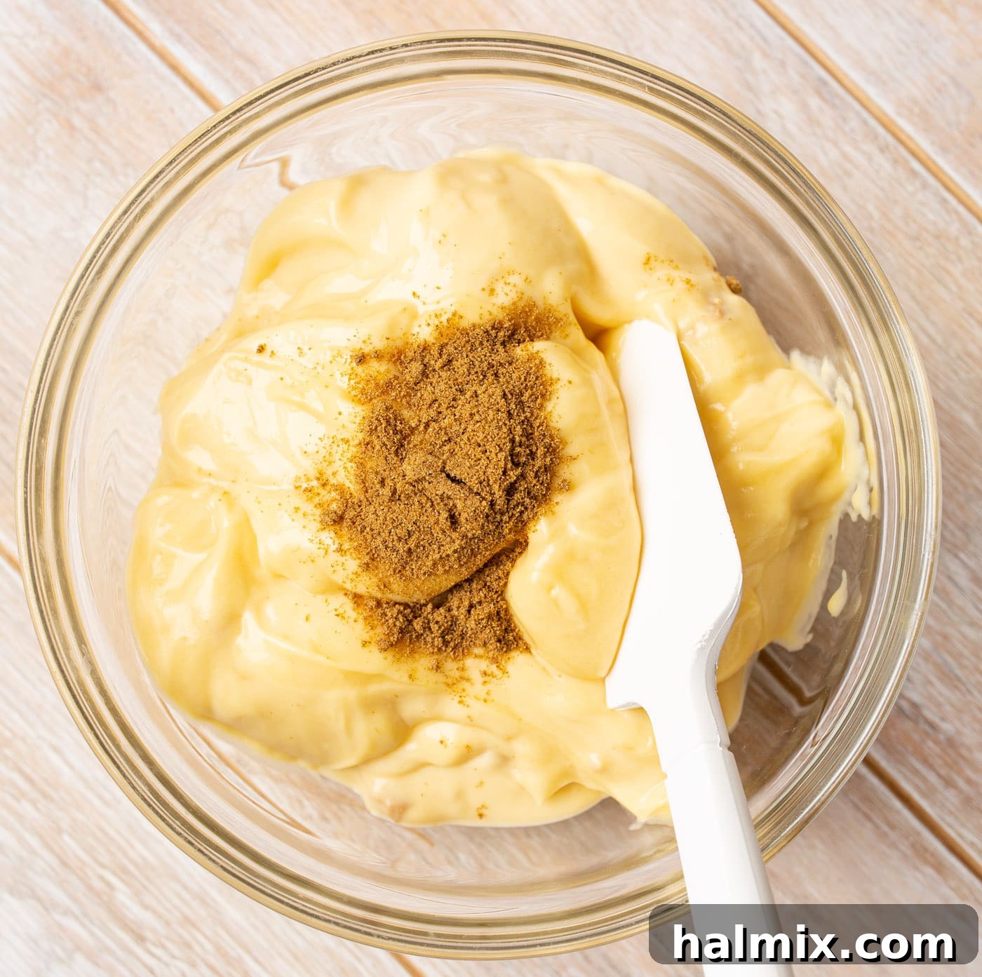 Slow Cooker Fiesta Chicken 6 spatula mixing cream of chicken with cumin