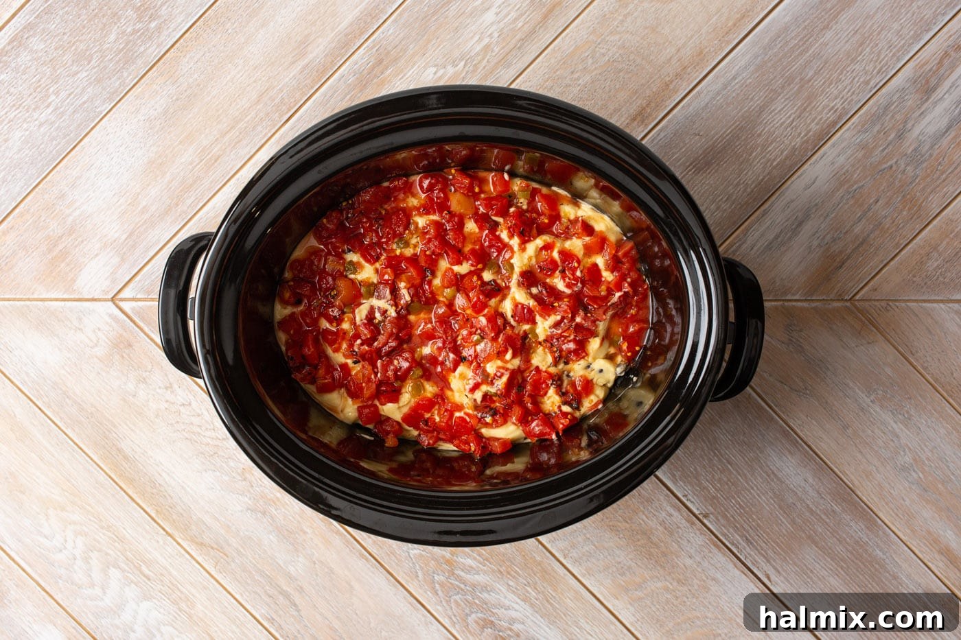 Slow Cooker Fiesta Chicken 7 rotel tomatoes on top of cream of chicken and black beans