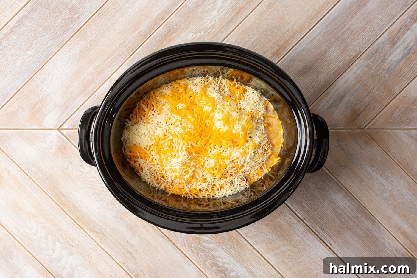 Slow Cooker Fiesta Chicken 8 cheese on top of crockpot mexican chicken
