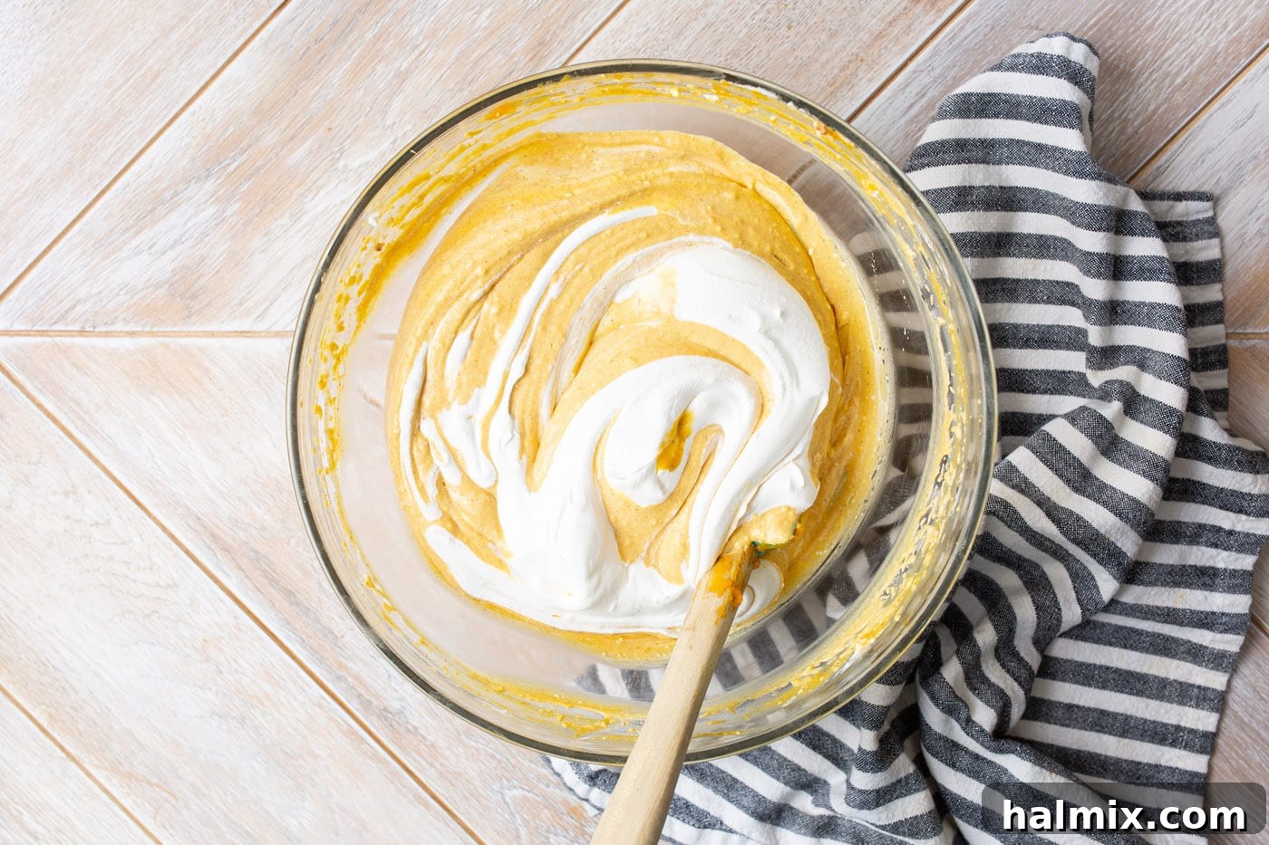 whipped topping stirred into pumpkin cheesecake