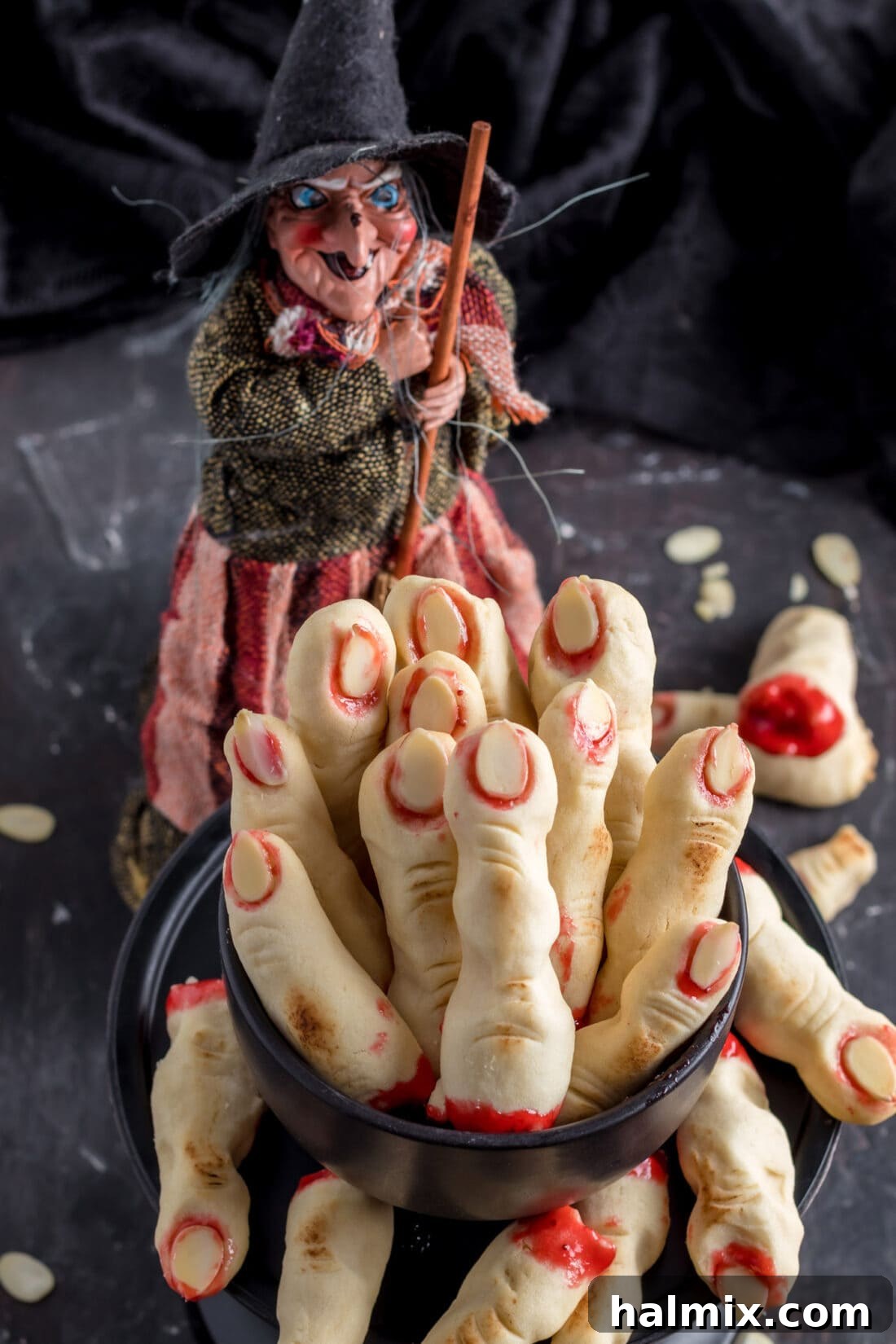 Hexed Hand Delights 17 A festive display of Witch Finger Cookies in a decorative Halloween dish, perfect for serving.