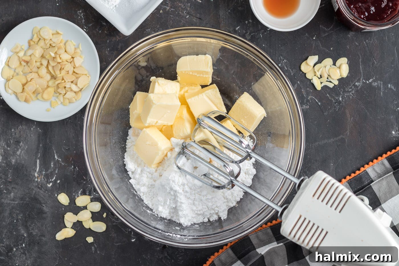 Hexed Hand Delights 5 Creamy mixture of butter and powdered sugar in a mixing bowl, perfectly prepared for adding further ingredients.