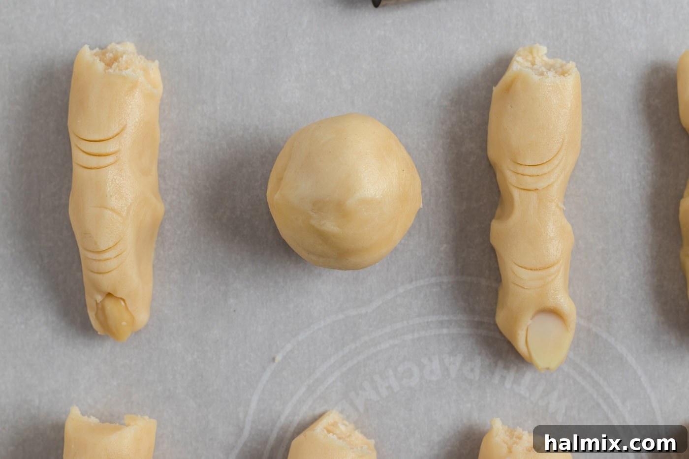 Hexed Hand Delights 8 A perfectly rolled ball of cookie dough, ready to be shaped into a witch finger.