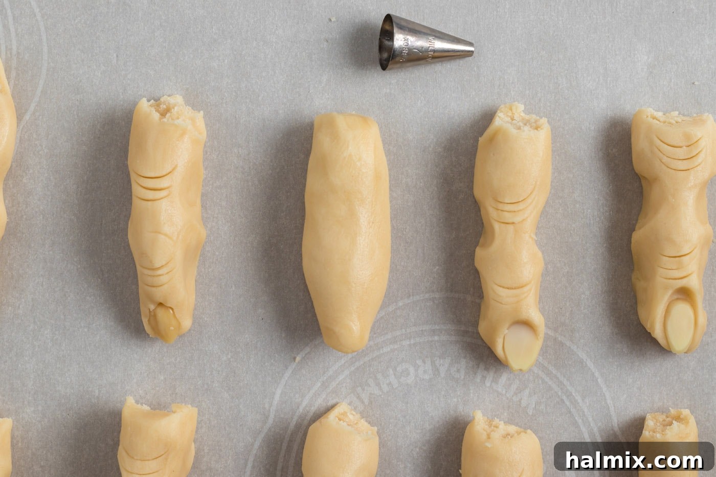 Hexed Hand Delights 9 Cookie dough shaped into a 3-inch cylinder, resembling the basic form of a finger.