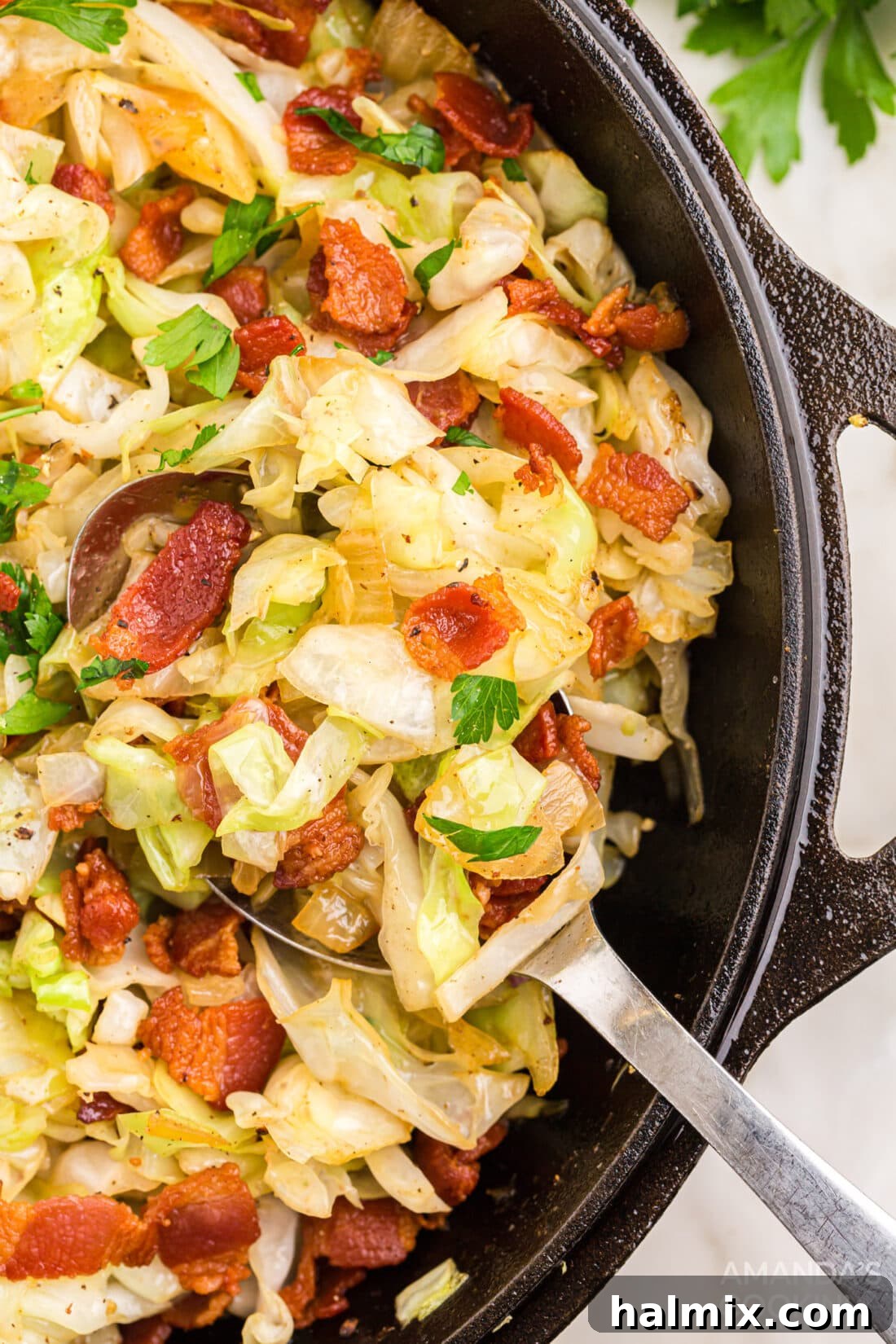 Fried Cabbage in pan with serving spoon