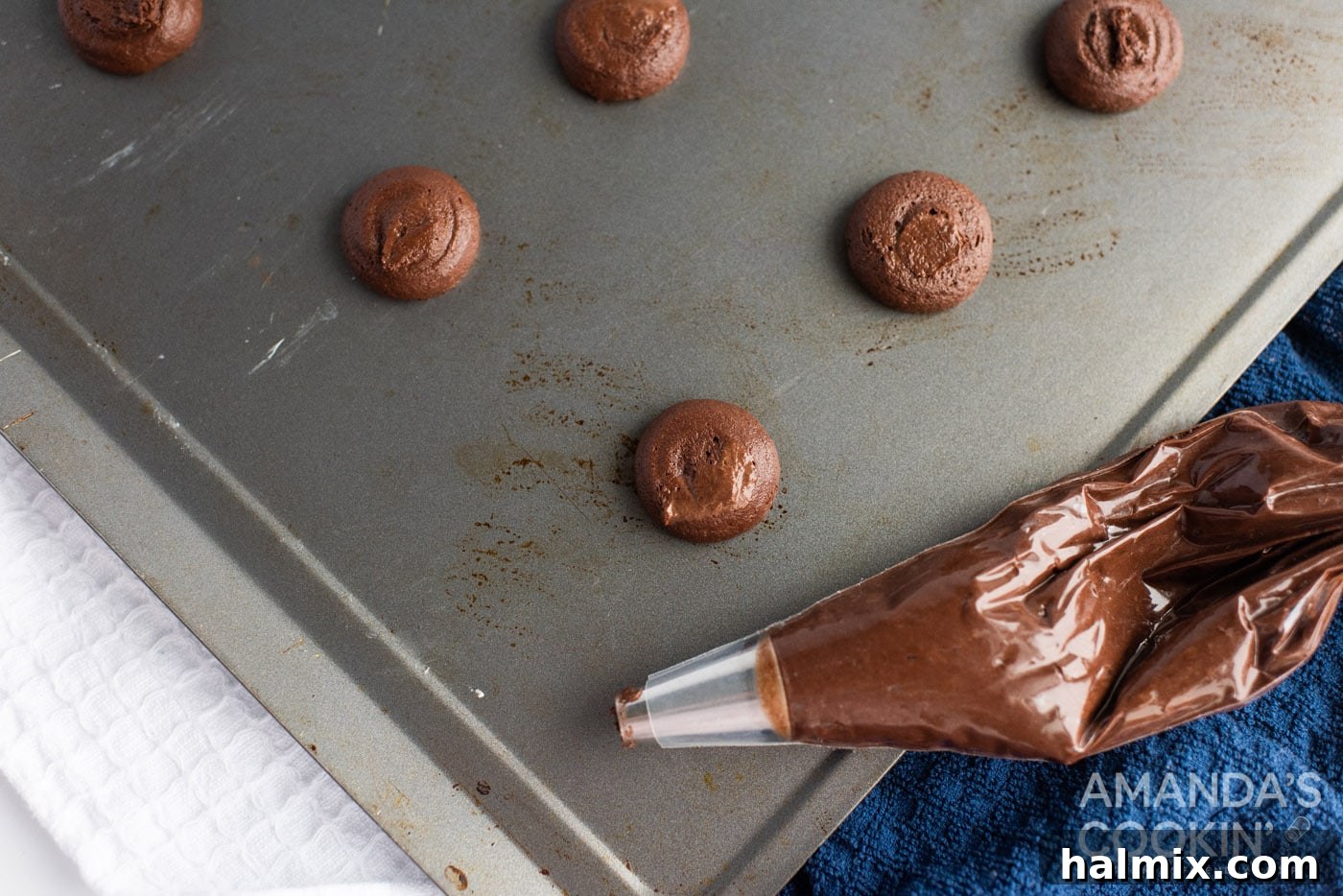 chocolate whoopie pie dough in a piping bag