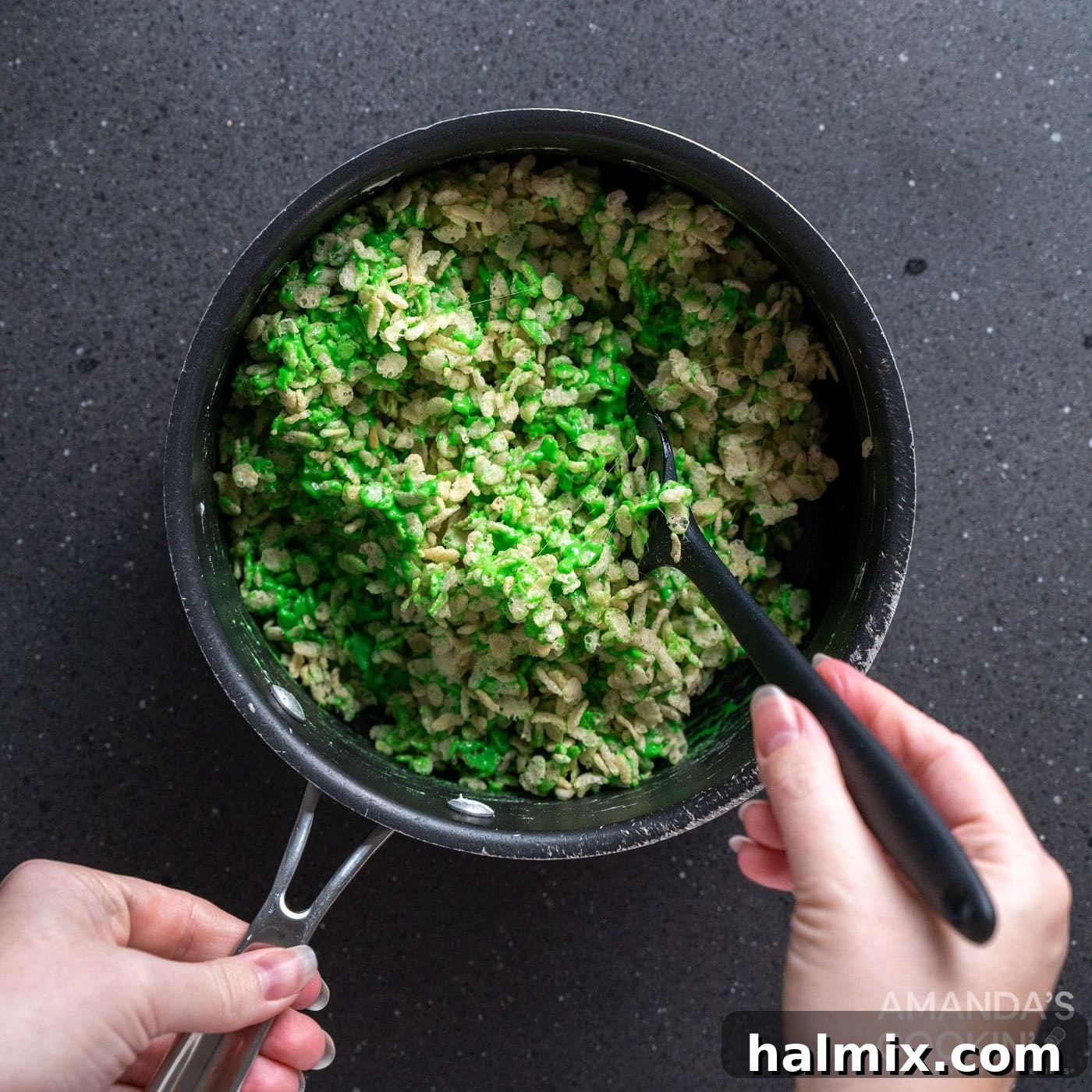 Frankenstein's Krispie Creations 8 Stirring rice krispie cereal into green marshmallows