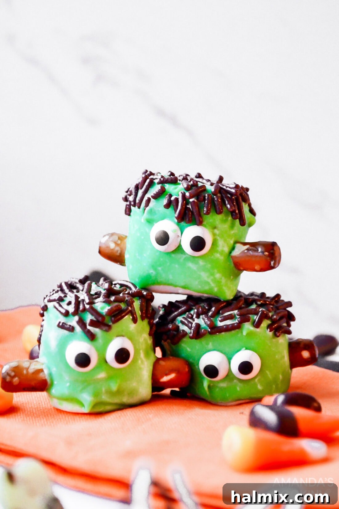 A festive stack of completed Marshmallow Frankensteins, ready for a Halloween celebration.