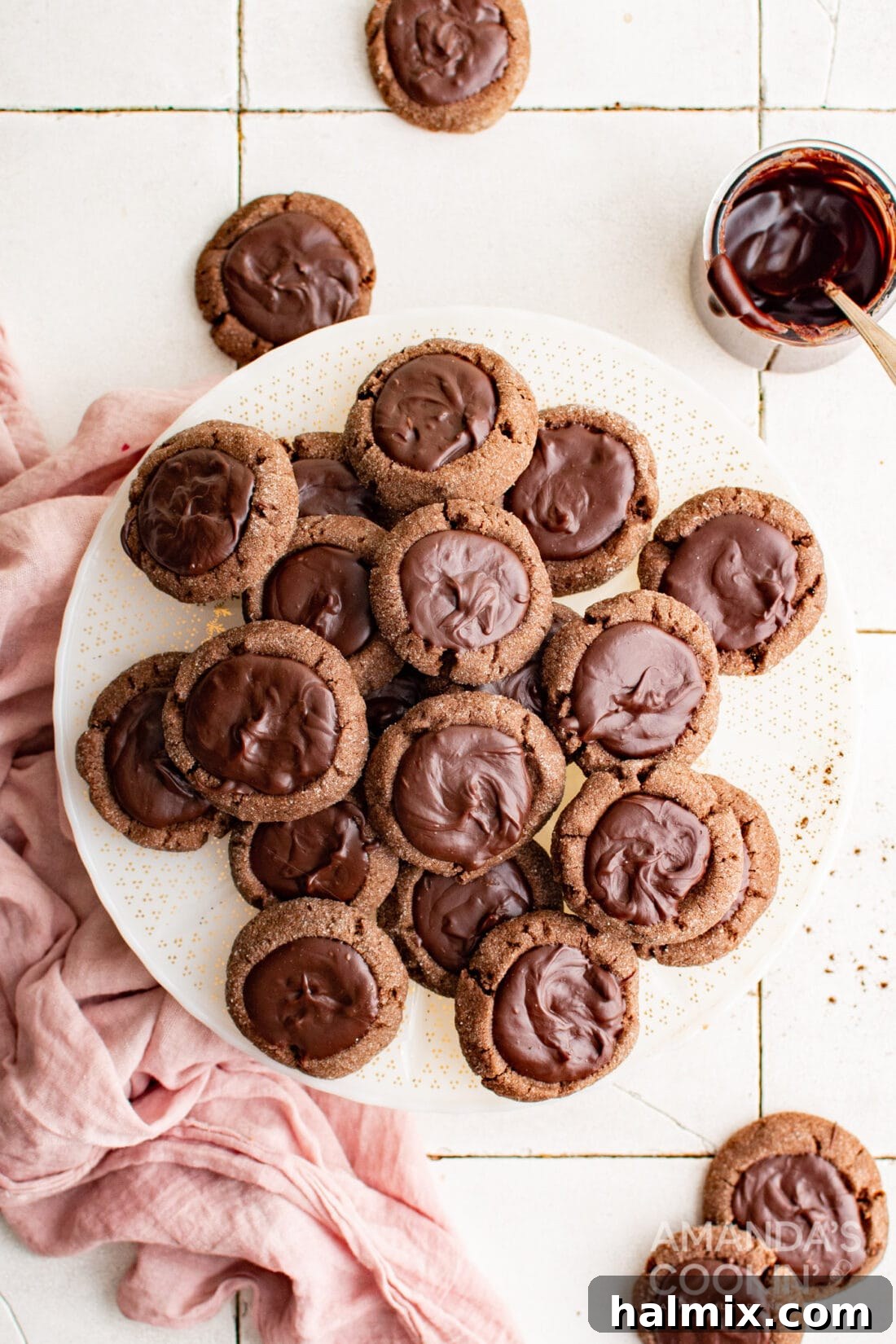 plate of Chocolate Thumbprint Cookies, showcasing their fudgy chocolate centers and soft, chewy texture.