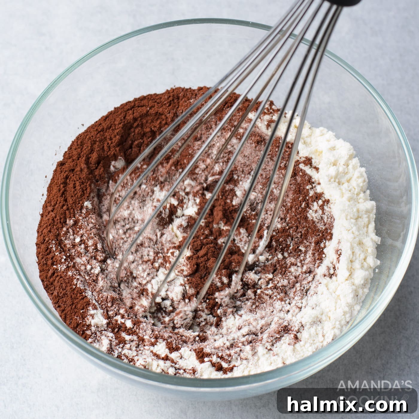 Whisking flour, cocoa powder, and salt together in a bowl