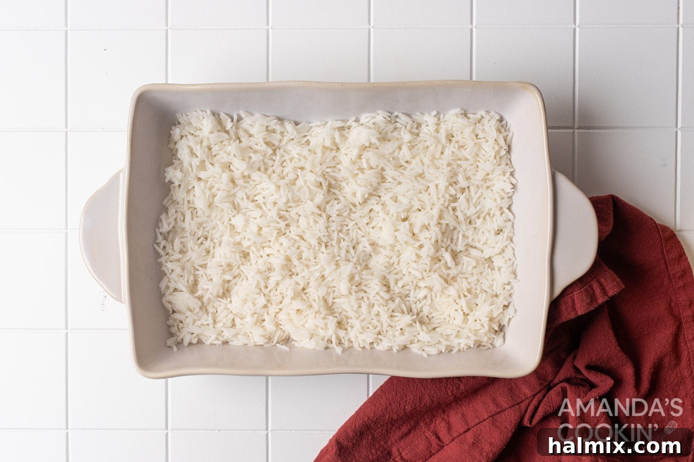 cooked white rice forms the first layer in the casserole dish
