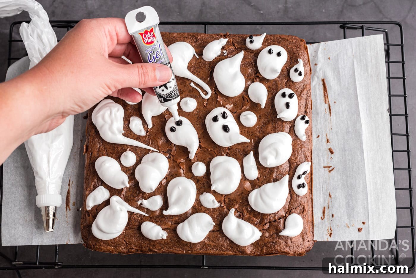 gel icing on marshmallow ghosts to make eyes and mouths