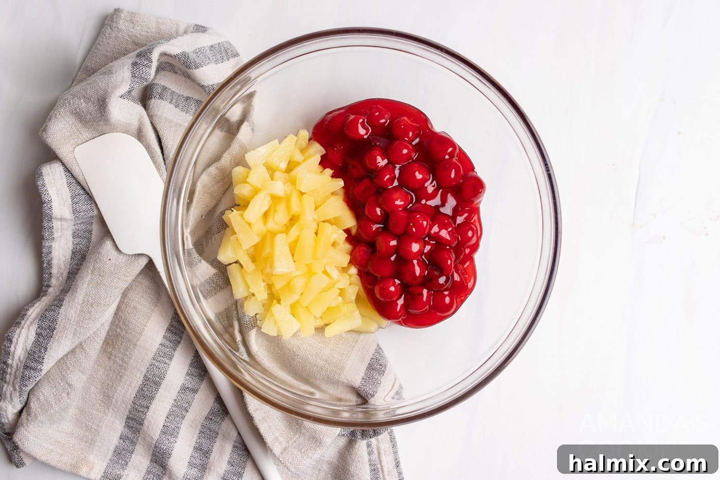 cherry pie filling and pineapple in a bowl