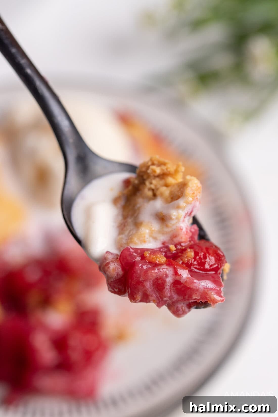 spoon of Cherry Pineapple Dump Cake
