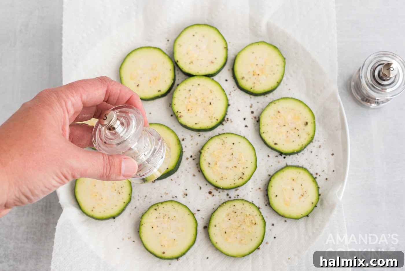 Zucchini Stackers 5 Seasoning zucchini rounds with salt and pepper