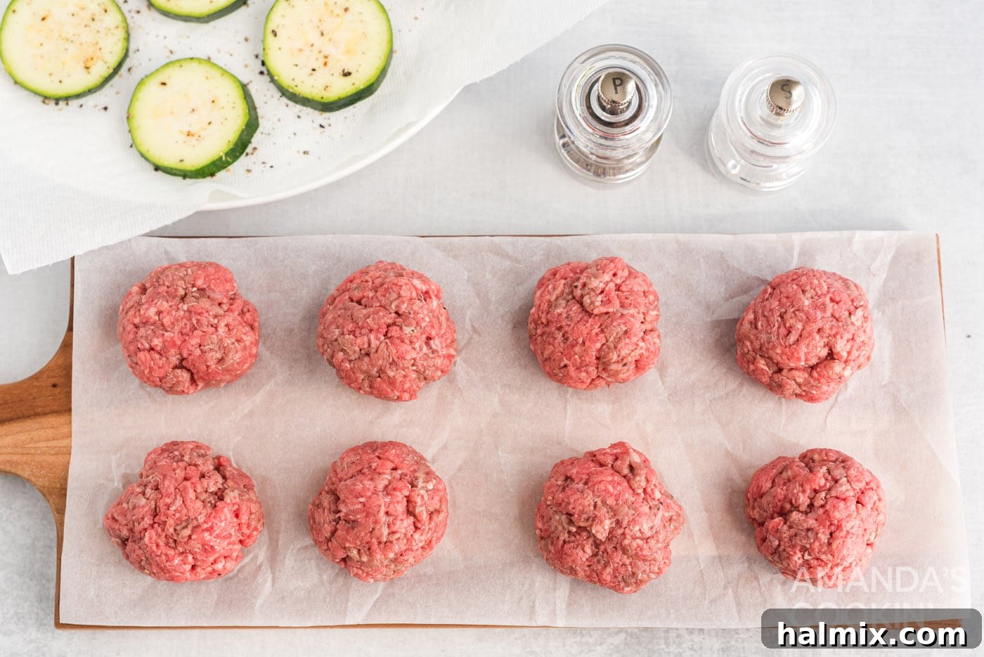 Zucchini Stackers 7 Mini burger patties on parchment paper, ready to cook