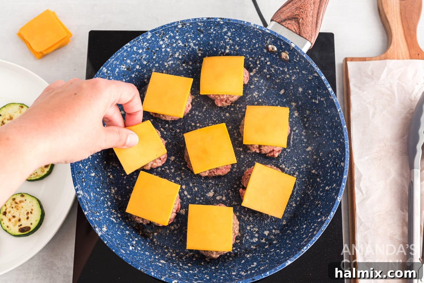 Zucchini Stackers 10 Mini cheeseburgers with melted cheese in a skillet