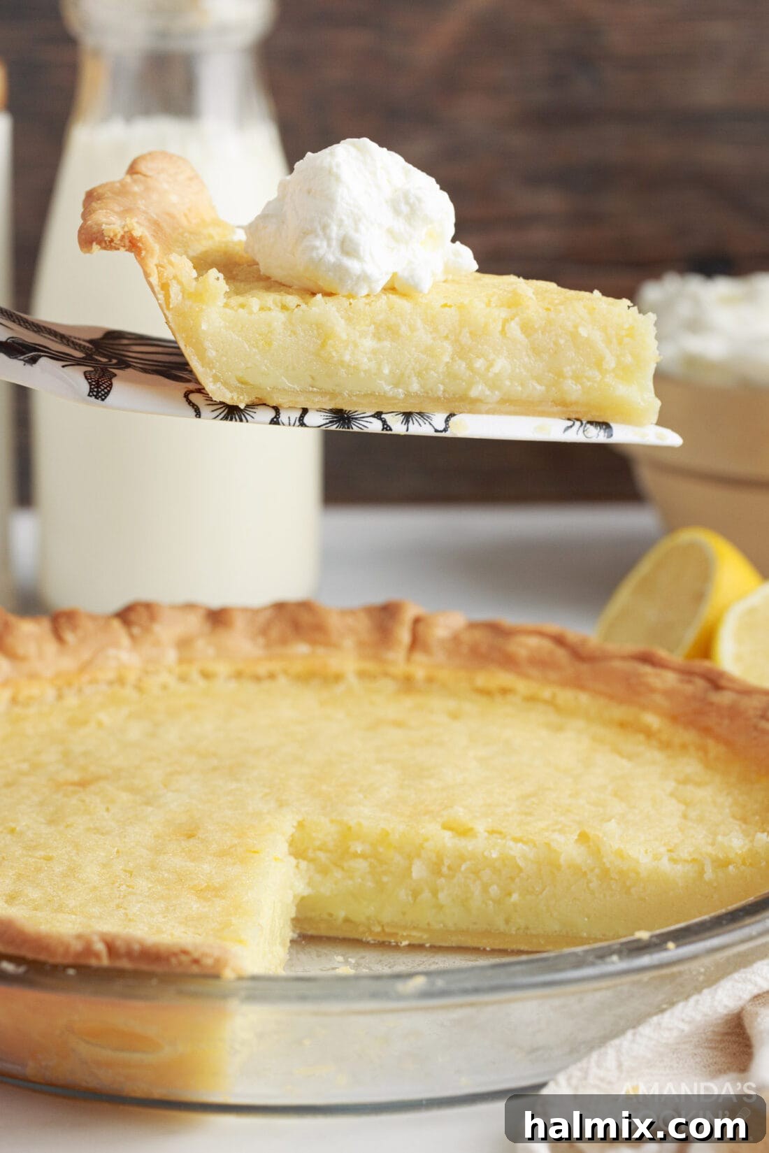 slice of Southern Buttermilk Pie being removed from pan