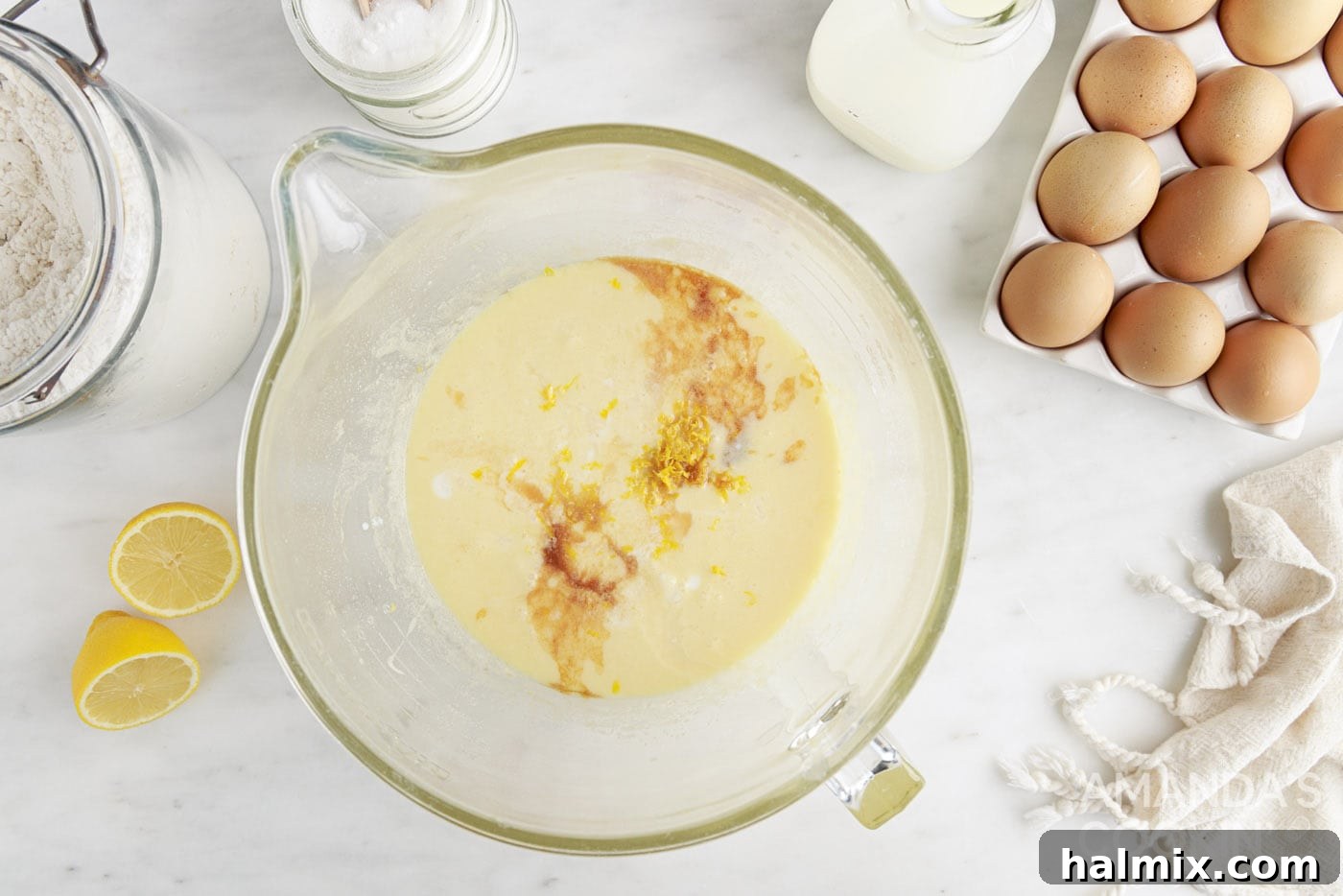 melted butter in a mixing bowl with sugar, vanilla, and