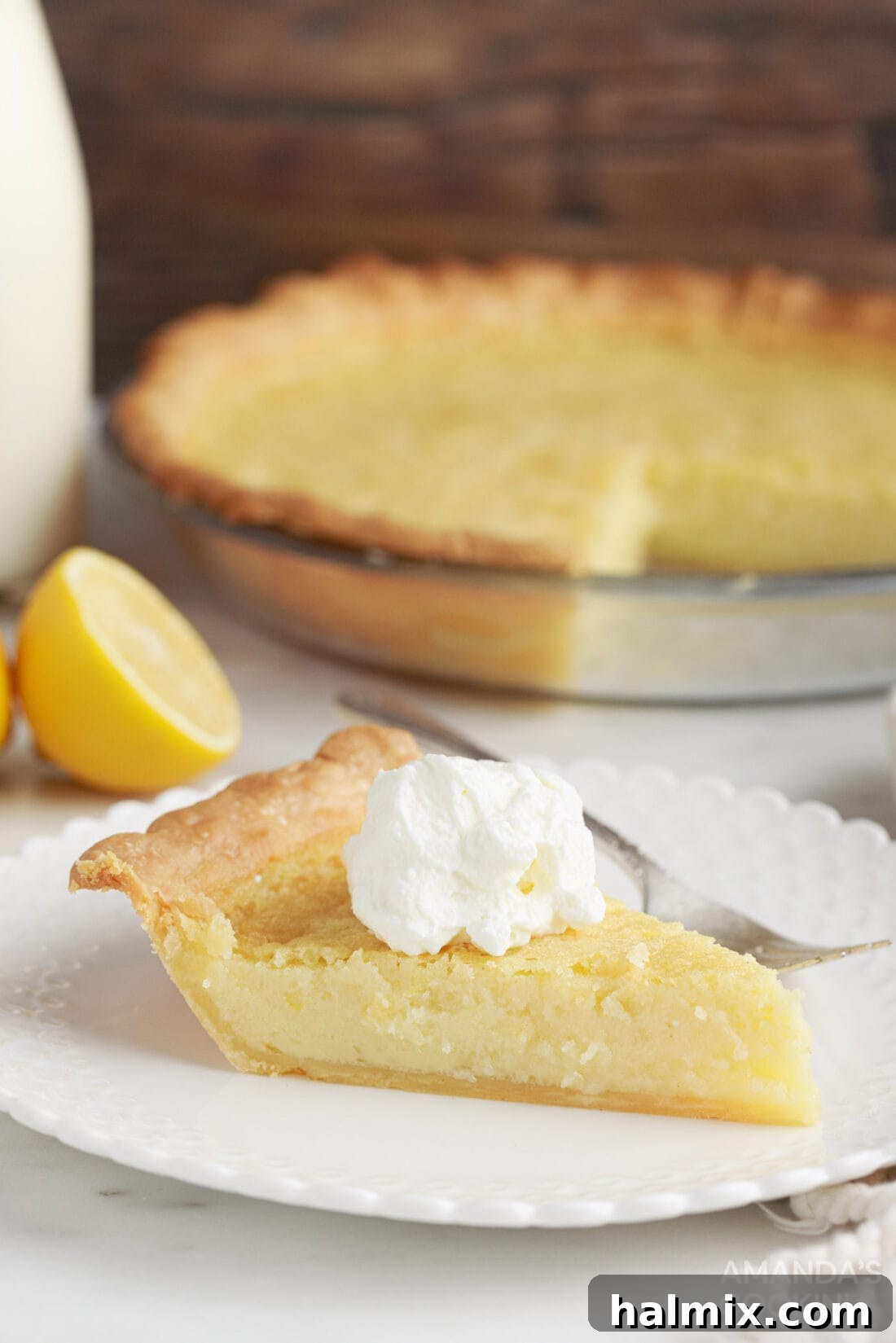 slice of Southern Buttermilk Pie with whipped cream