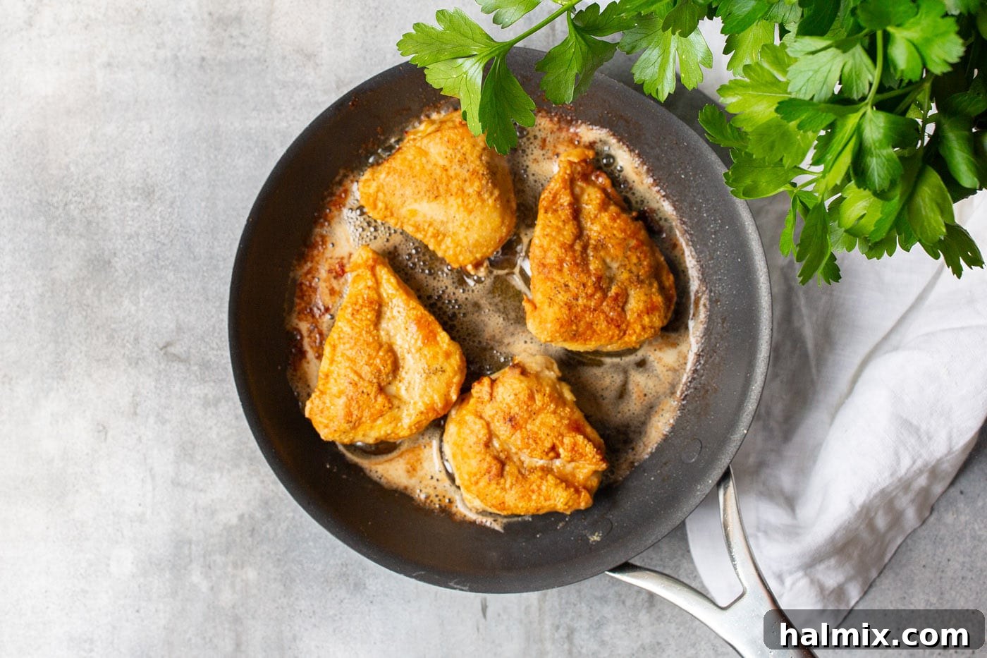 Zesty Lemon Caper Chicken 6 Pan-fried golden chicken breasts in a skillet