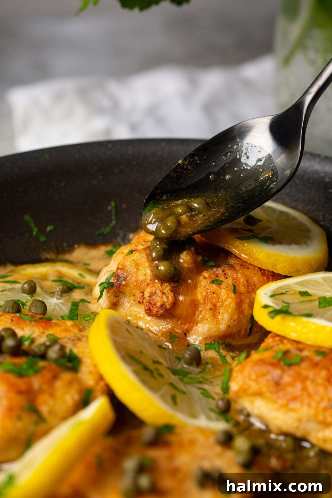 Zesty Lemon Caper Chicken 9 Drizzling capers onto freshly cooked Chicken Piccata