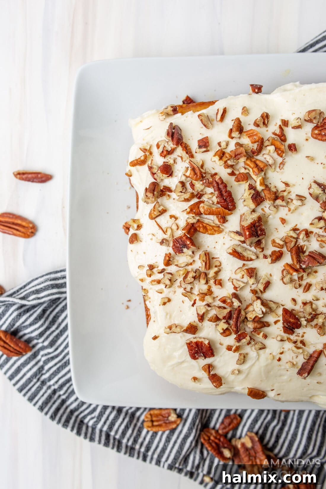 overhead view of Elvis Presley Cake with a full spread of frosting and pecans, ready to be served