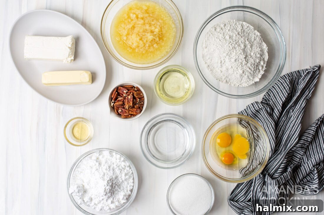 ingredients for Elvis Presley Cake laid out on a table, including cake mix, pineapple, sugar, cream cheese, butter, powdered sugar, vanilla, and pecans