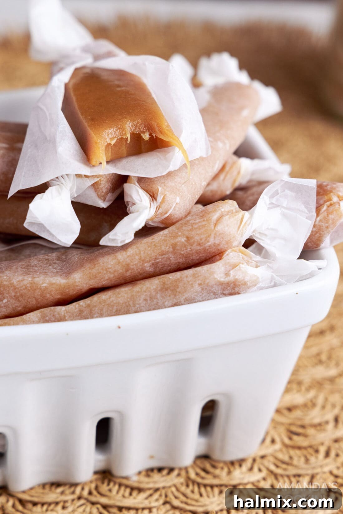 Soft and chewy homemade microwave caramels in a white dish, ready to be enjoyed.