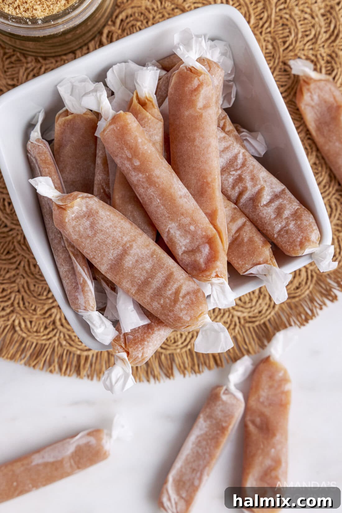 Overhead view of a batch of fresh homemade microwave caramels, glistening and ready for cutting.