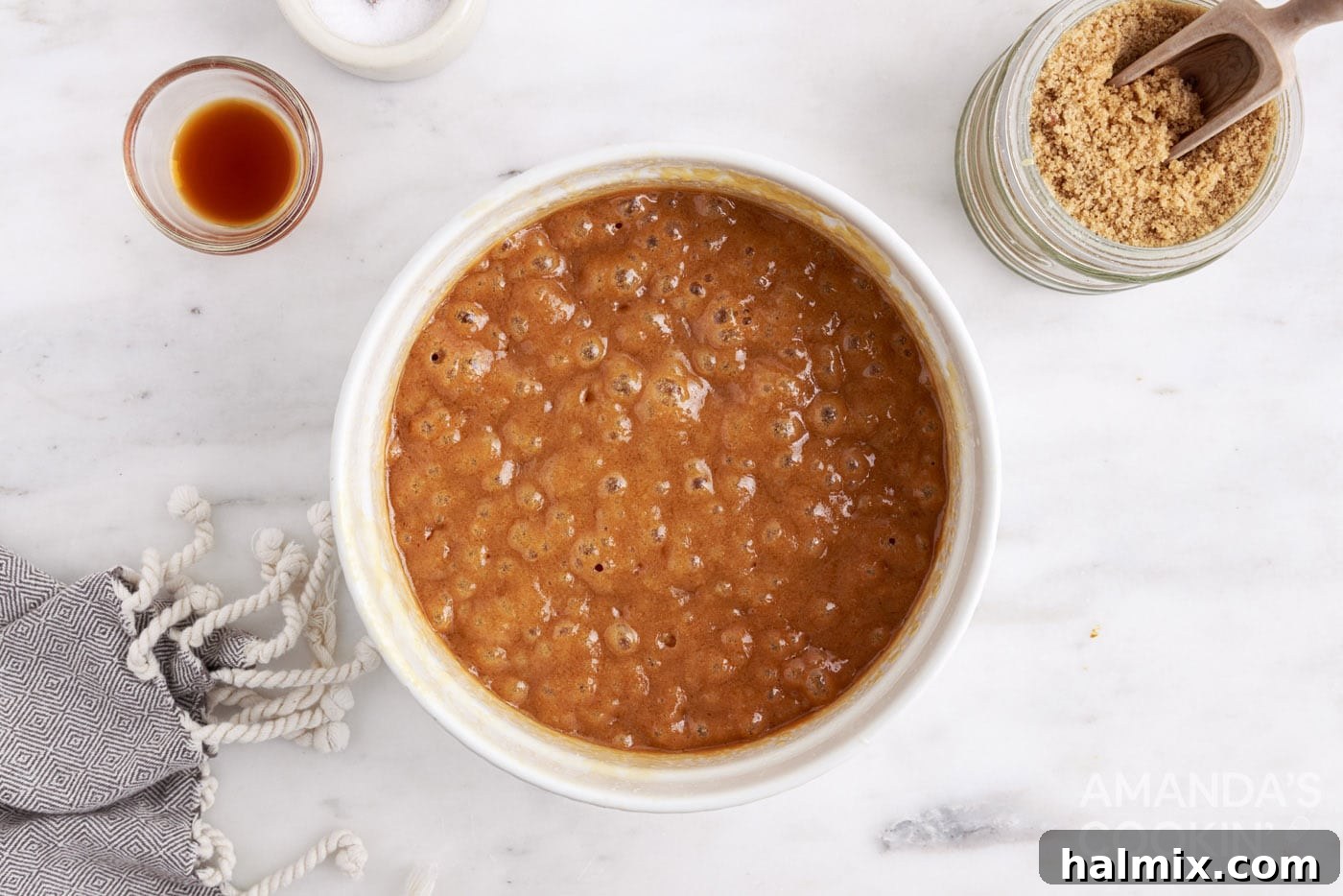 Hot, bubbling caramel mixture in a microwave-safe bowl, indicating it's almost ready.