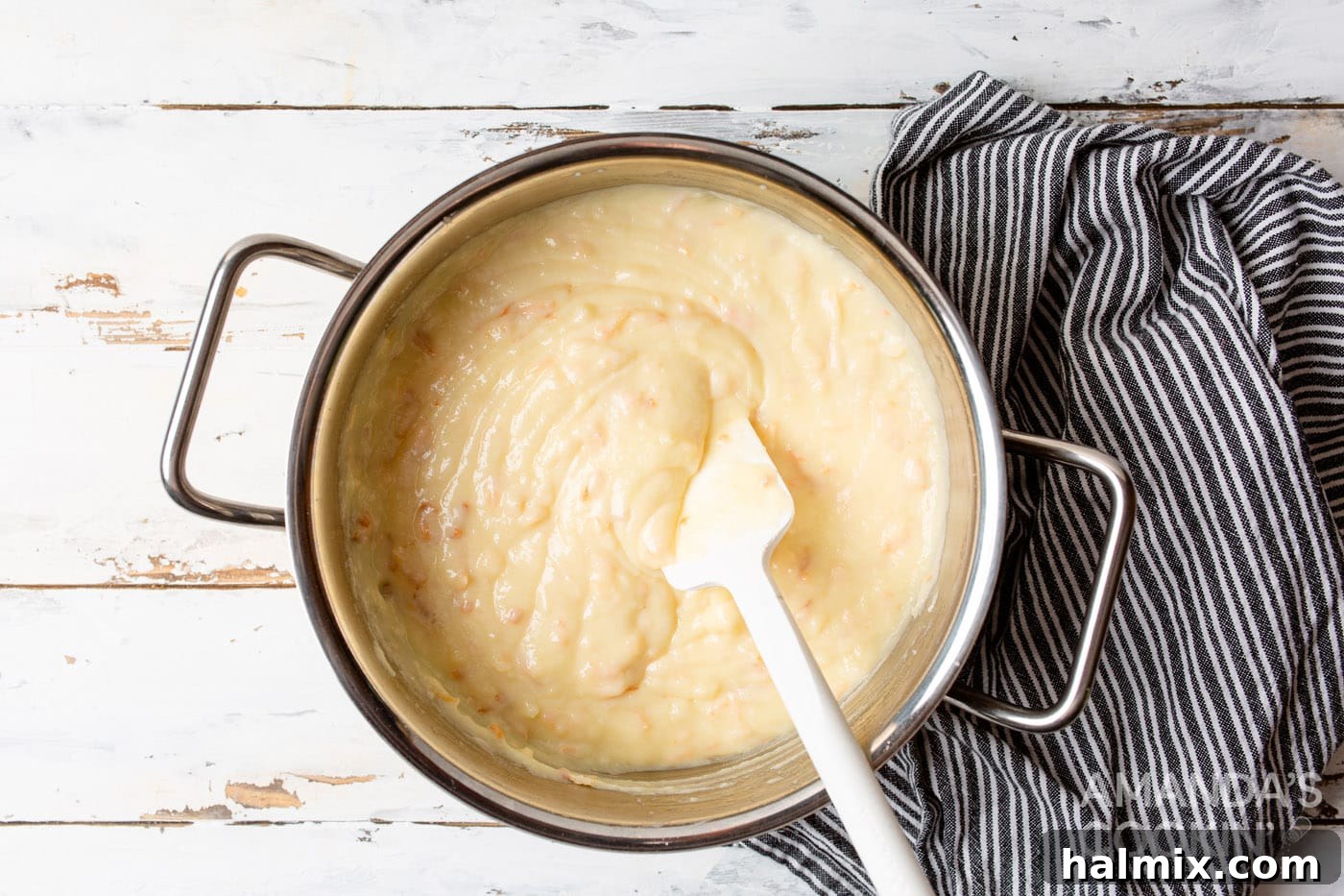 rubber spatula stirring coconut custard