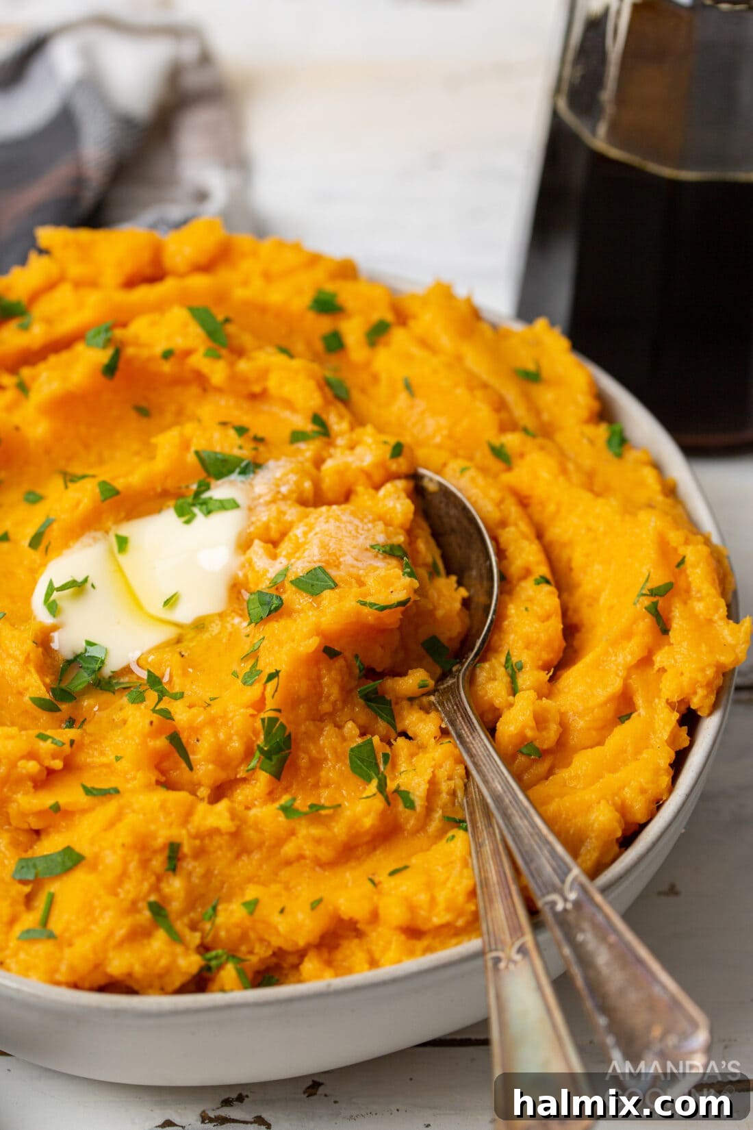 bowl of Mashed Sweet Potatoes with spoon