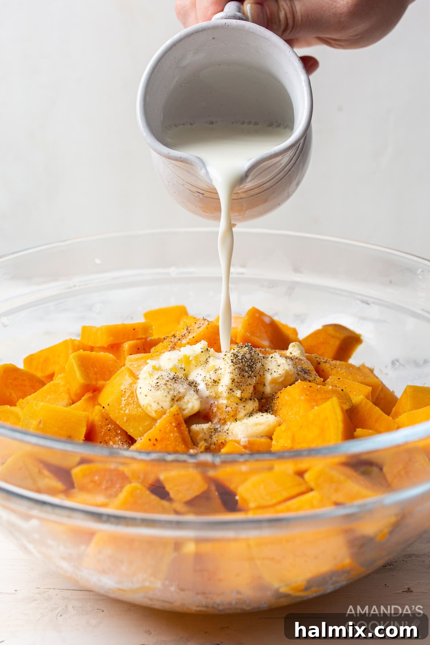 pouring milk over butter and sweet potatoes