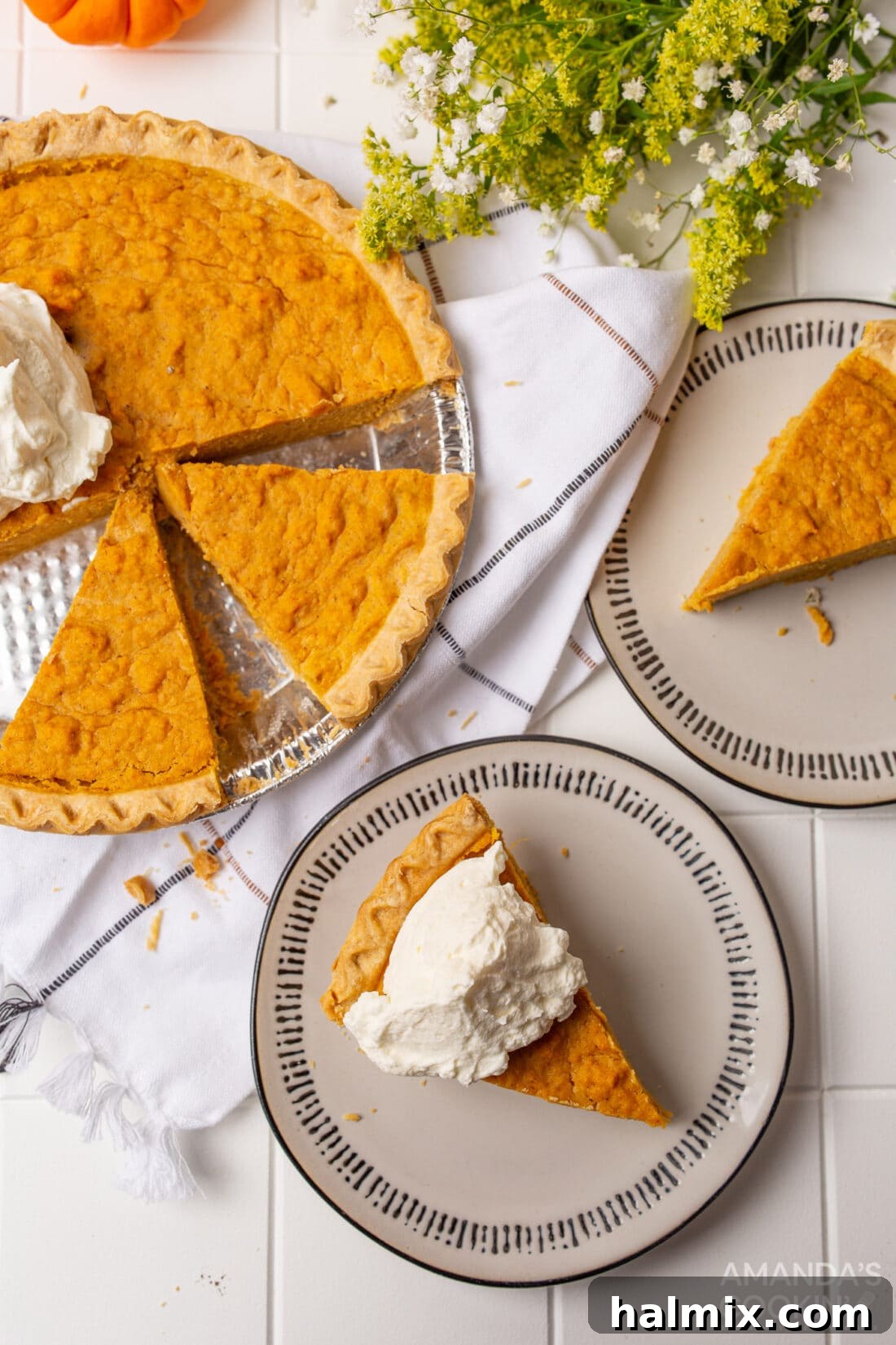 A Slice of Sweet Potato Heaven 8 Overhead view of a whole Sweet Potato Pie with a dollop of whipped cream